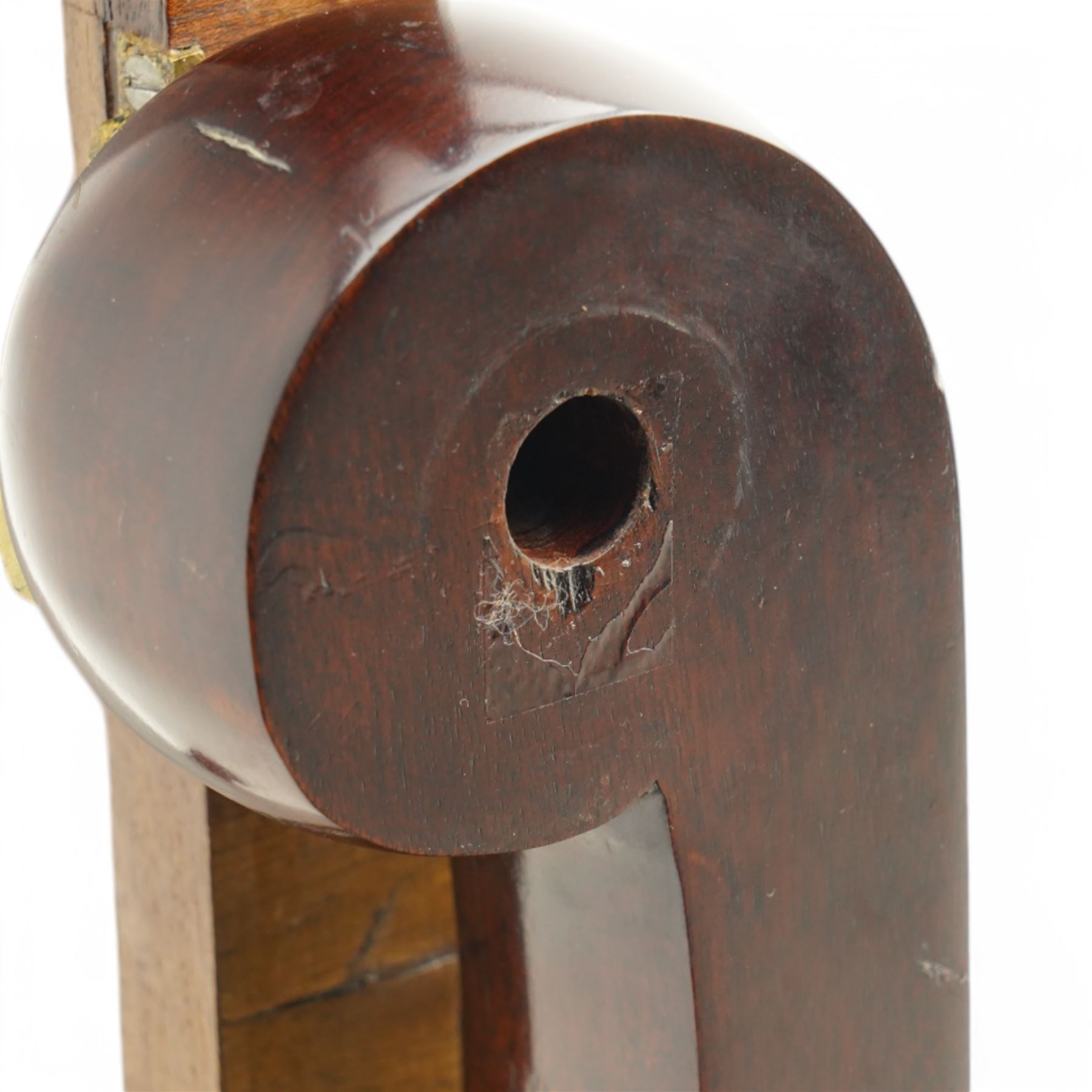 Early 19th century mahogany cheval dressing mirror, plain mirror plate within chamfered frame with arched top, on rolled horns and out-splayed rolled feet, united by turned stretcher 