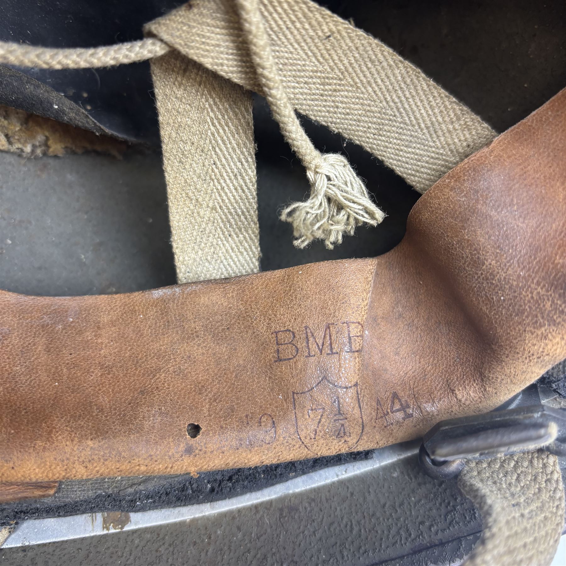WWII British parachute regiment helmet, marked BMB and dated 1944 to the leather liner, size 7 3/4, complete with liner, the canvas strap with leather chinpiece