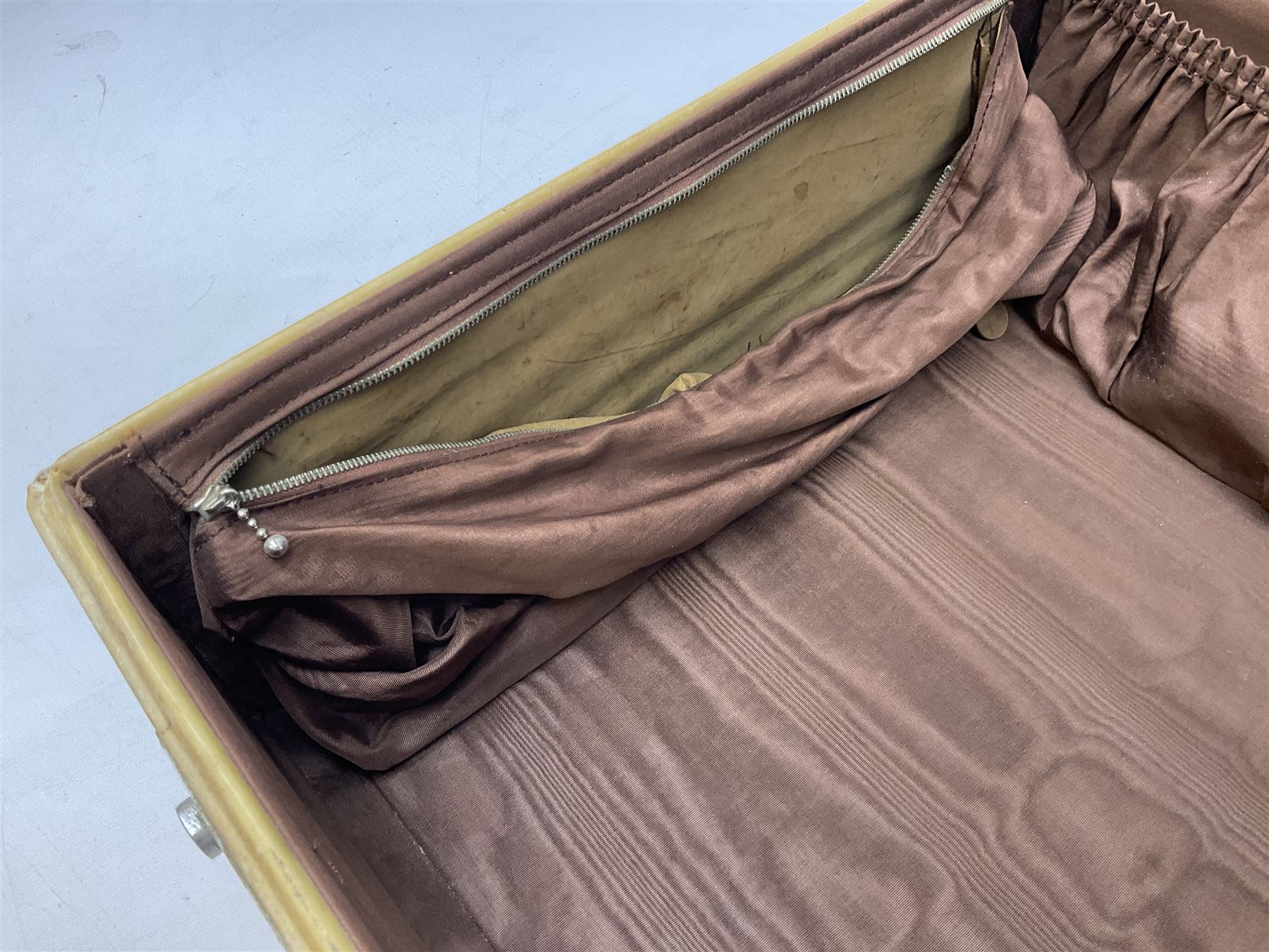 Vintage leather traveling case with monogram to cover, with watered silk lining to interior, and some contents, plus a further vintage travel case, (2)