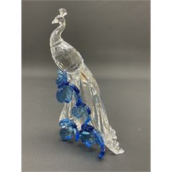 Swarovski Crystal animals, comprising white peacock, the tail with cascading blue flowers, perched eagle with yellow beak, ibex with frosted crystal horns and unicorn with frosted crystal horn, tallest H13cm