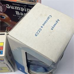 Twenty six tinplate models to include Ferris Wheel and Performing Circus Elephant, marked JW, further similar examples such as Duck on a Bike, Clown on Roller, Carousel; Popeye Tin Speedboat; Looney Tunes Wind Up Cars and Express Train; various international examples, MS107 Jumping Bambi, Pop Pop Boat, jumping frogs, pecking chickens etc; both boxed and loose