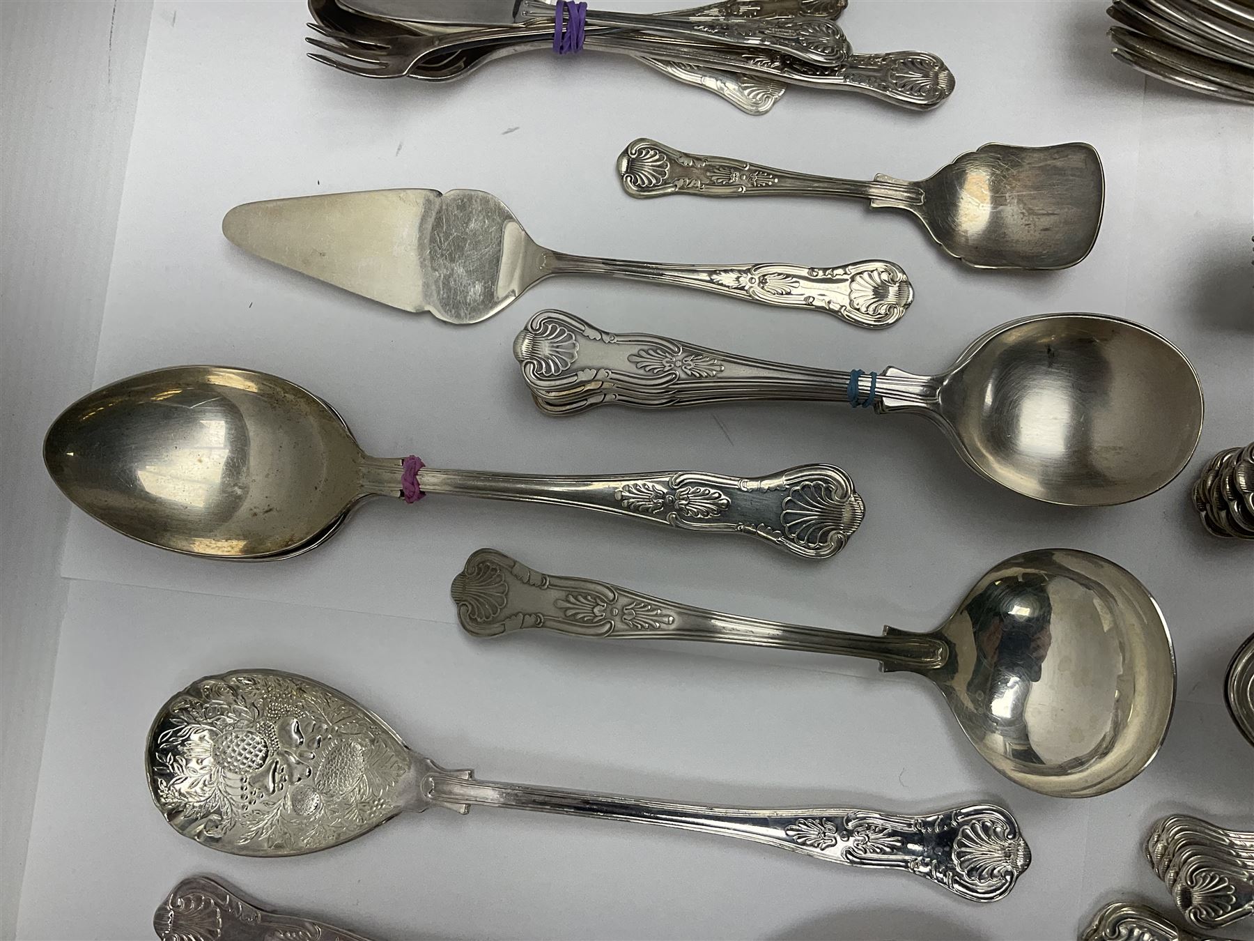 Silver Kings pattern knife, hallmarked Walker & Hall, together with a quantity of silver plated Kings pattern cutlery, including items by Osbourne's and United Cutlers, comprising table knives, table forks, table spoons, serving forks, ladle, berry spoons, teaspoons, dessert forks, cake slice, etc