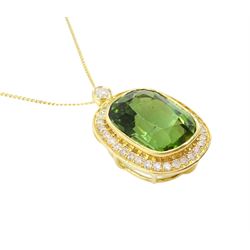 18ct gold green tourmaline and diamond pendant necklace, rectangular cushion cut tourmaline of approx 9.50 carat, surrounded by thirty-four round brilliant cut diamonds and a single stone diamond set bail, on a trace link chain necklace