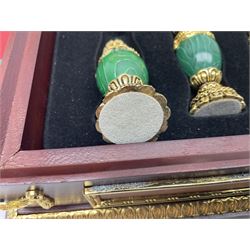 Franklin Mint House of Faberge 'The Imperial Jewelled Chess Set', to include set of chess pieces with malachite finish and a set with carnelian finish and a hardwood chess board