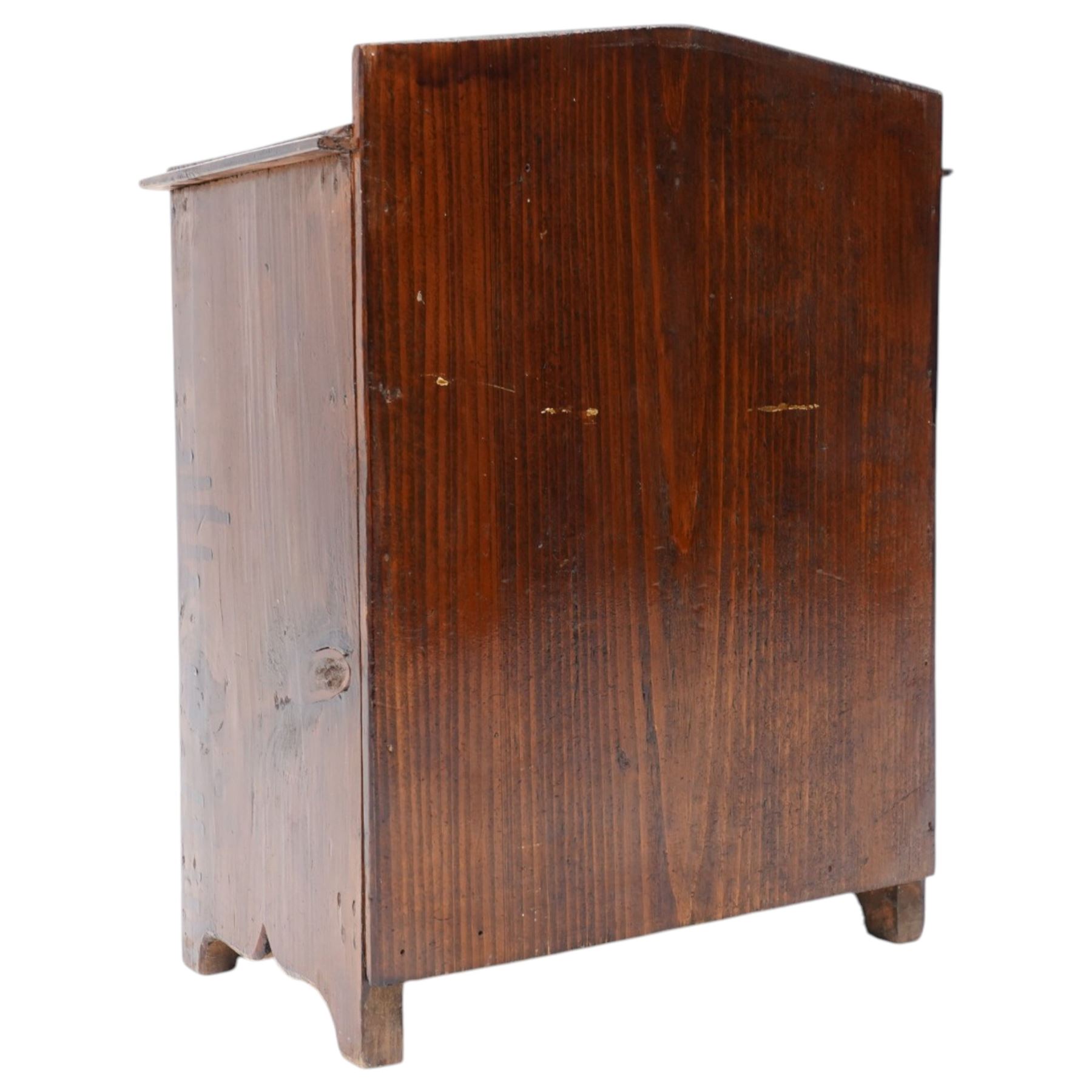 Miniature stained pine chest of two long and two short drawers above a shaped apron W28cm