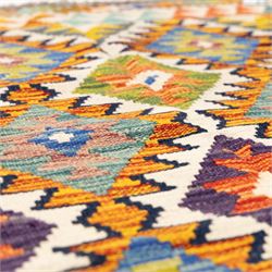 Two Chobi flatweave kilims with a repeating stepped diamond medallion design in live green, rust, teal, purple, and ivory, framed by chevron and geometric borders, 121x80cm & 87x60cm 