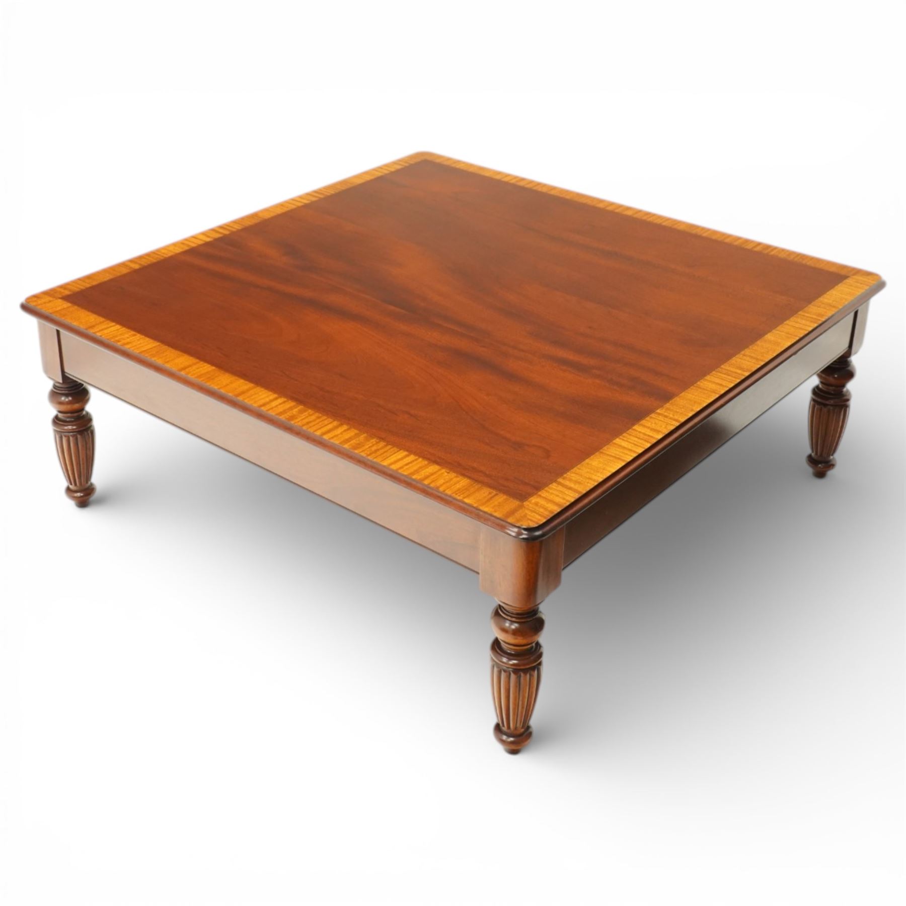 Georgian design mahogany coffee table, square top with satinwood crossbanded border above plain frieze, raised on turned and fluted supports