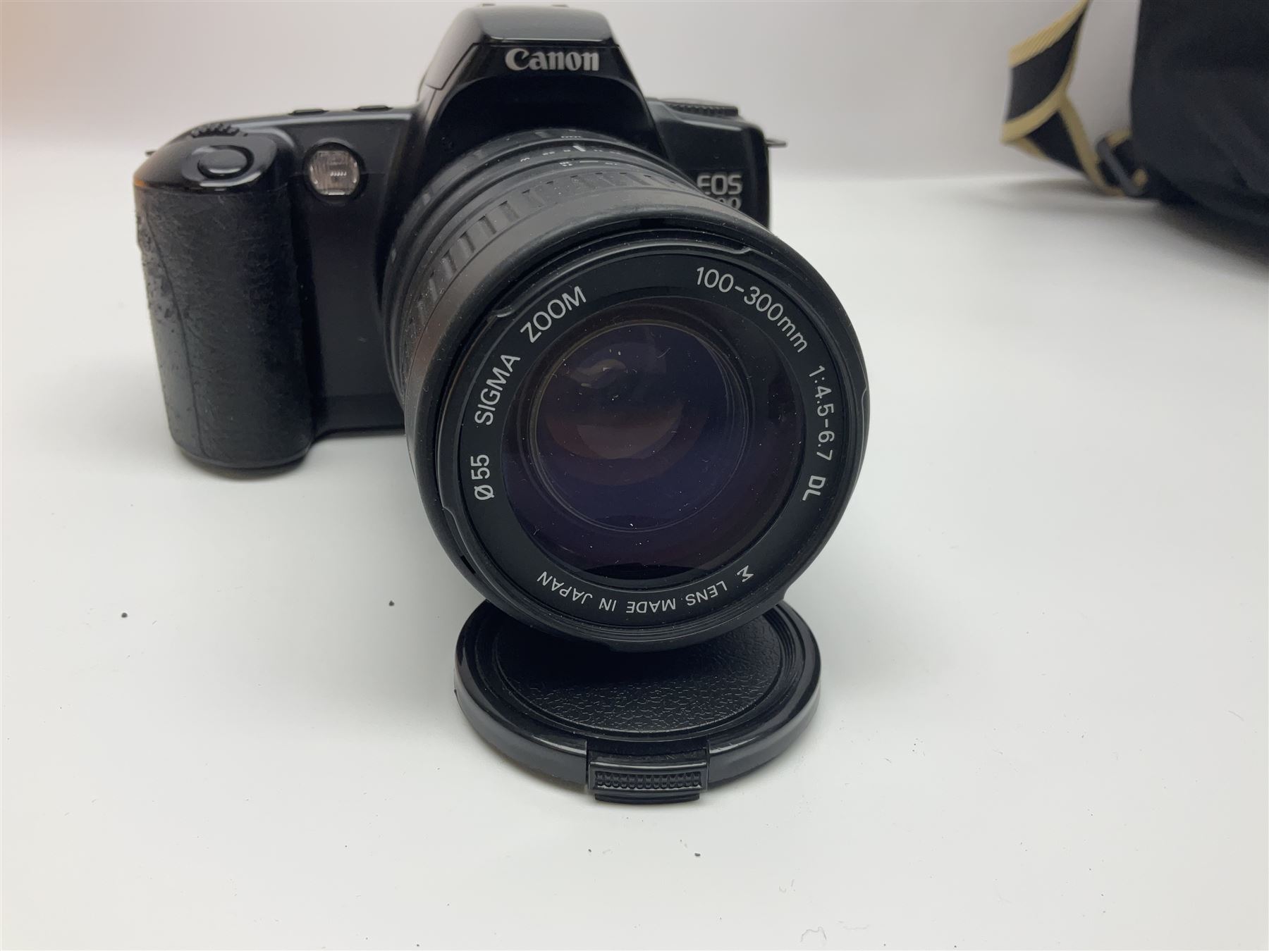 Four camera bodies, to include, Ricoh KR-10 serial no. 38826, Pentax MZ-M serial no. 4185969 with 'SMC Pentax- M 1:3.5 28mm' lens, Canon EOS500 serial no. 080927, with 'Sigma Zoom 100-300mm 1:4.5-6.7 DL'  lens etc, with other camera lenses and equipment 