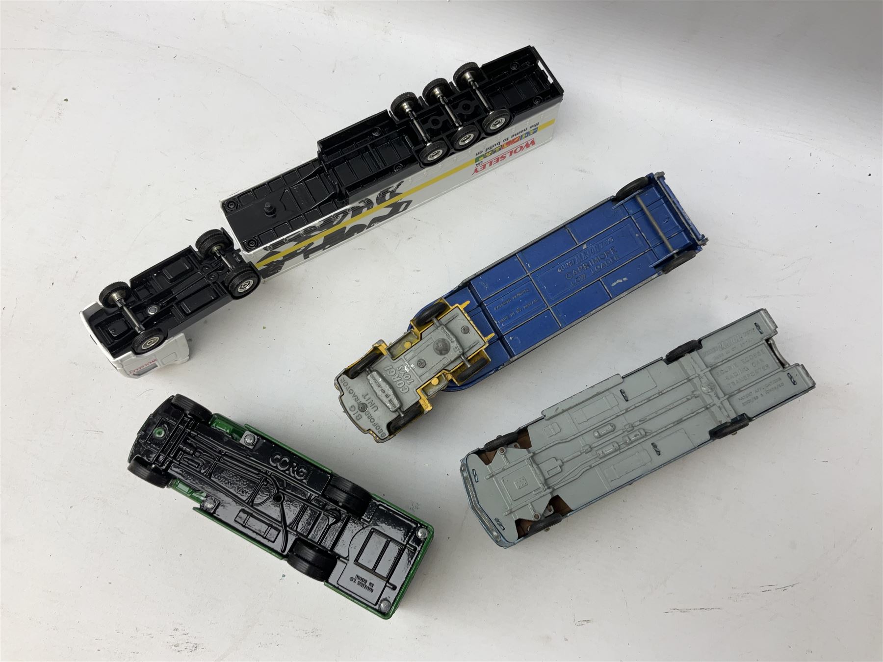 Corgi - eighteen unboxed and playworn/repainted die-cast commercial vehicles including Commer 5-Ton Wagon with drop-side trailer and two other 5-Ton wagons, Dodge Key Fargo, Jeep FC-150, two London Routemaster buses, Carrimore Trideck Transporter, two Carrimore Mark IV Transporters, Carrimore Low Loader, Ecurie Ecosse Racing Car Transporter etc (18)