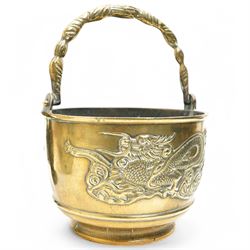Chinese 20th century polished bronze rice pot with swing handle and raised pattern of dragons D18cm, Meiji period Japanese bronze two handled vase H13cm and a Chinese porcelain bowl from the Tek Sing cargo D15cm (3)