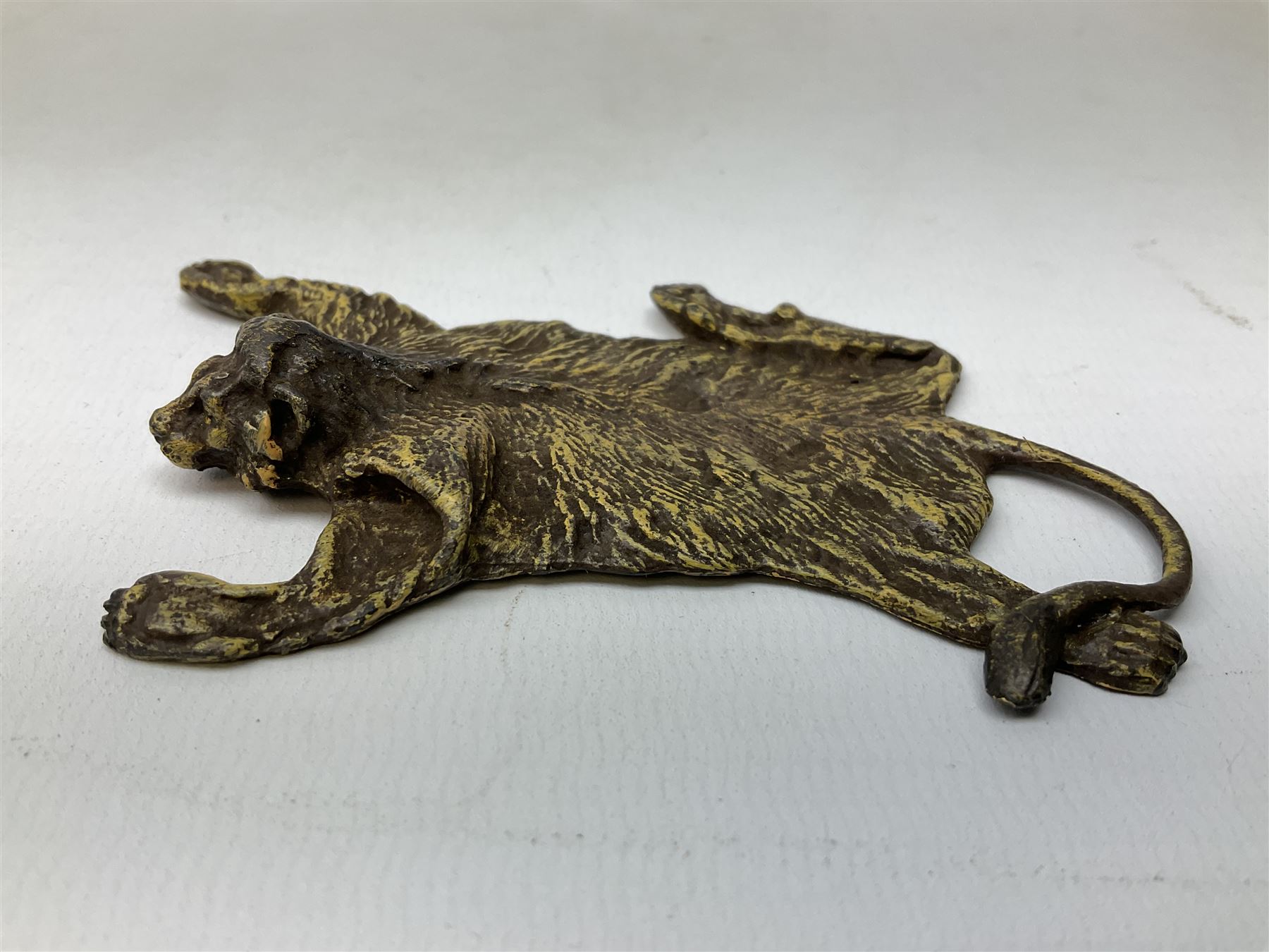 Attributed to Franz Xavier Bergman, cold painted bronze modelled as a lion skin, stamped beneath with B within an amphora and Austria, L10cm