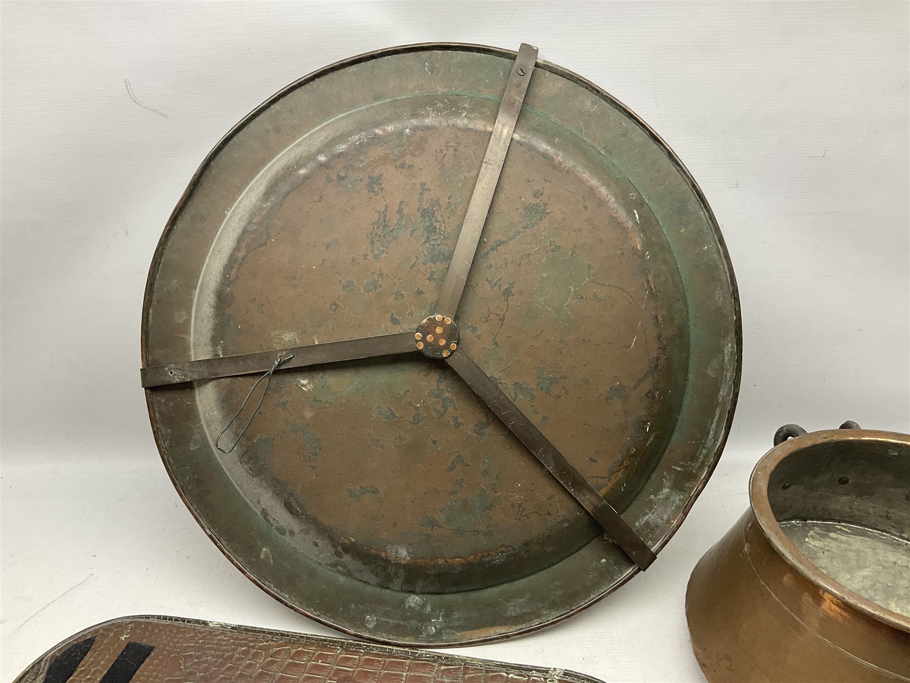 Copper pot with twin iron handles, large heavy planished brass charger and brass crocodile tray, charger D59cm