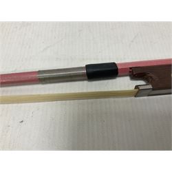 Zest full size pink violin, with a solid wood body and maple head, with matching pink bow and two further bows, in a hard case Length 60cm