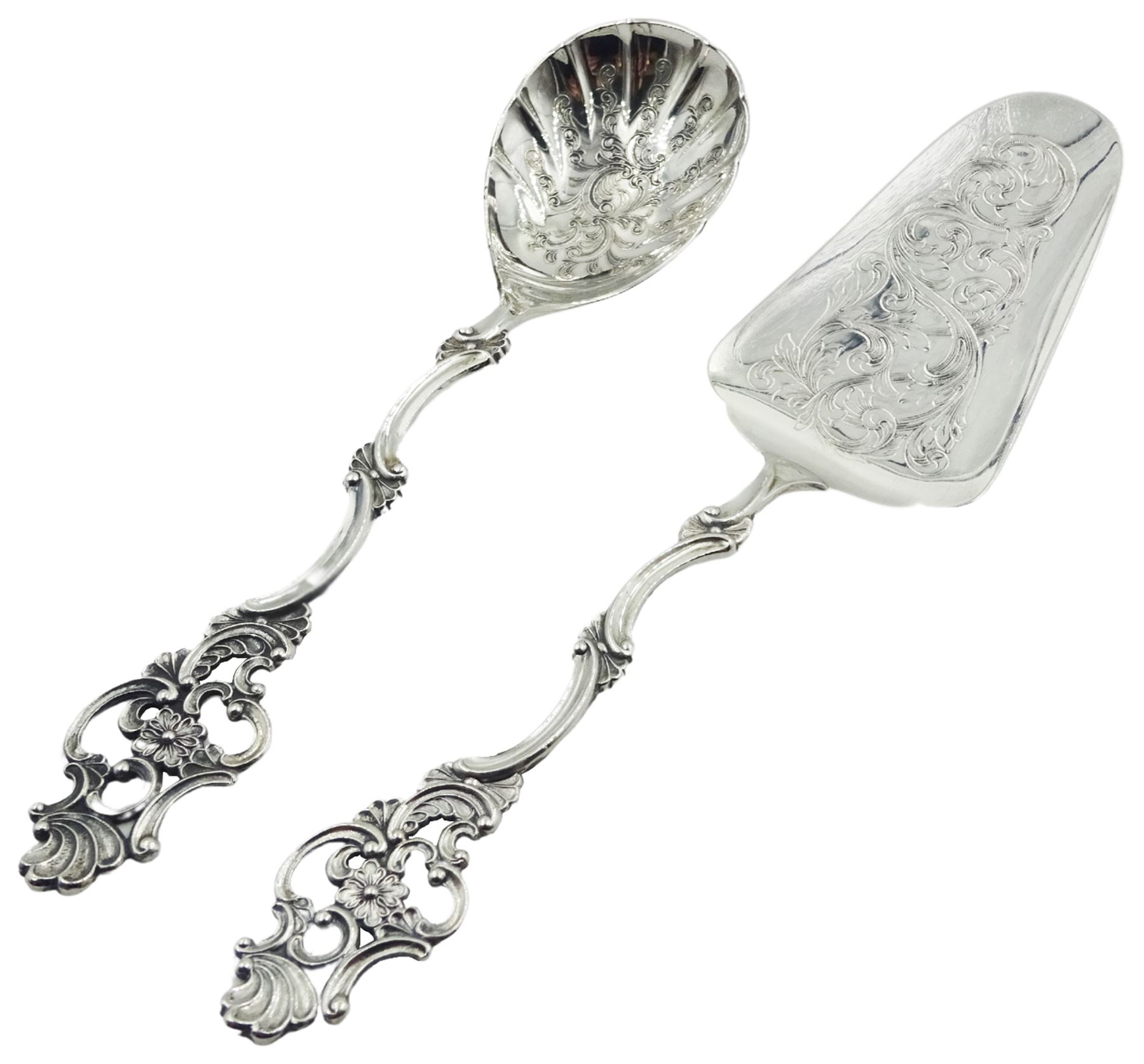 Early 20th century Norwegian silver cake cake slice and matching serving spoon, each with shaped stem and pierced and foliate modelled terminal, and engraved foliate decoration to bowl and blade, with fineness stamp 830S, NM 'Norskt Monster' mark, and makers mark for Thorvald Marthinsen Sølvvarefabrik, Tonsberg, approximate weight 2.90 ozt (90.5 grams)