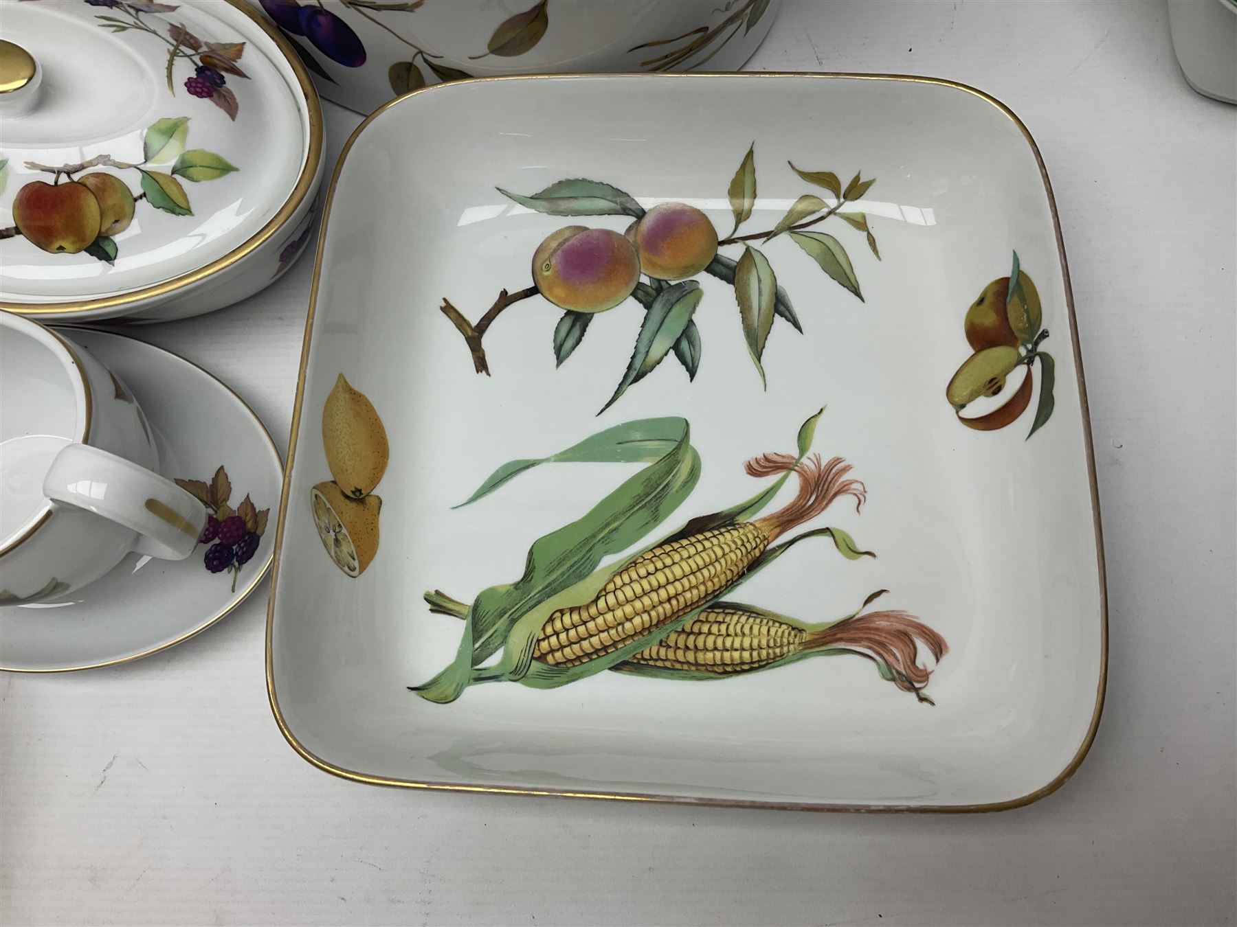 Royal Worcester Evesham pattern, including covered pot de cremes, twin handle tureen, serving dishes, flan dishes, side plates etc  