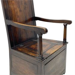18th century elm box-seat lambing chair, dished cresting rail over panelled back, panelled hinged lid flanked by two turned arm supports