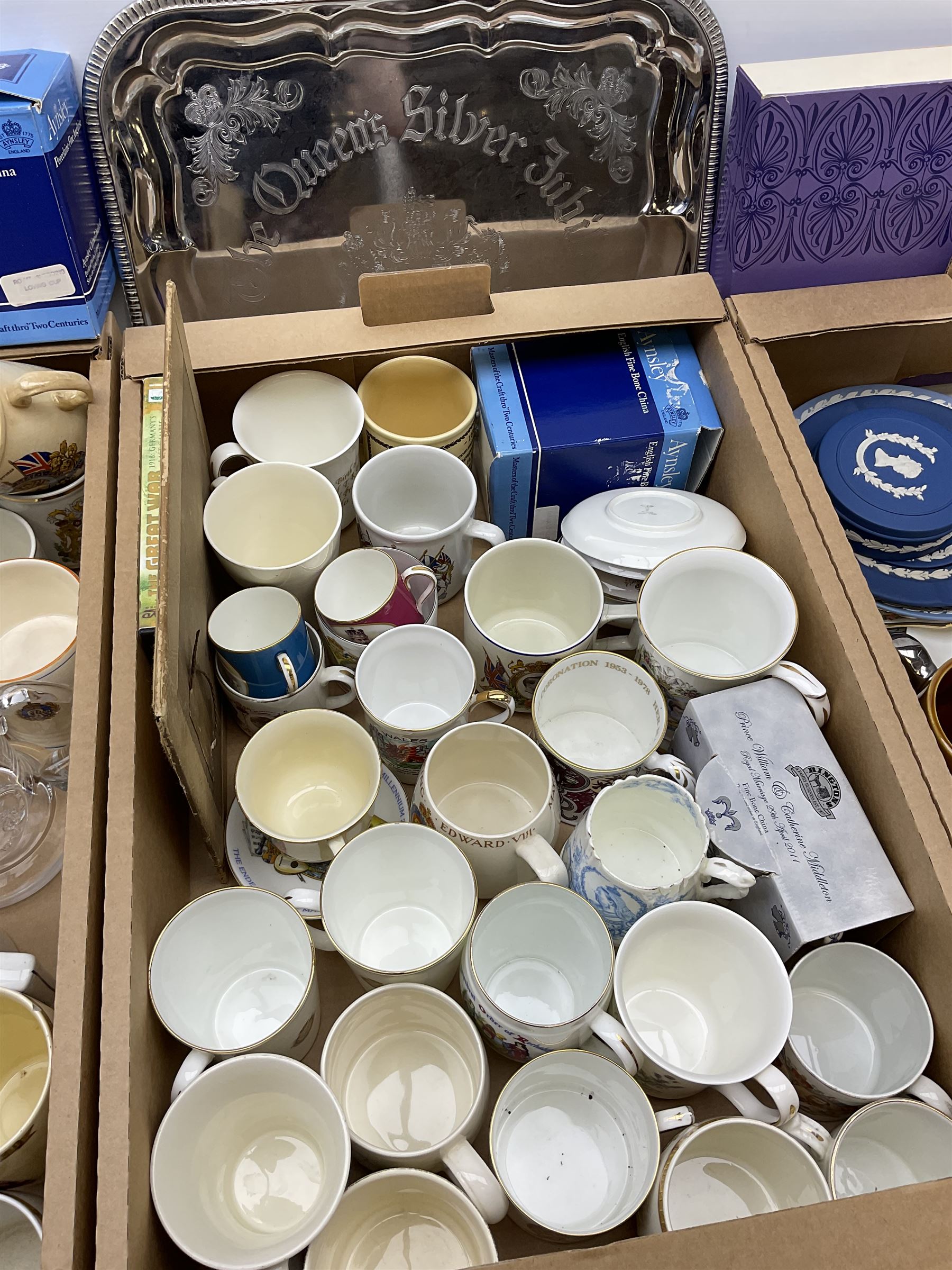 A large collection of commemorative ware, including Wedgewood Jasperware plates and trinket box for Royal silver jubilee, Shelley teacup and saucer for Edward VIII coronation, Bisto cups and saucers for George V and Queen Mary's coronation in 1911, loving cup, 1937 Coronation basket, thimbles, magazines and new cuttings etc. 