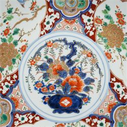 Japanese Imari charger decorated with panels of birds and flowers in orange, blue and red etc D37cm and two smaller Imari plates D21cm (3) 
