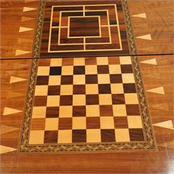 19th century mahogany fold-over card table, the crossbanded rectangular top opening to reveal an inlaid games centre with chessboard and backgammon designs, raised on turned and reeded legs with extending rear supports
