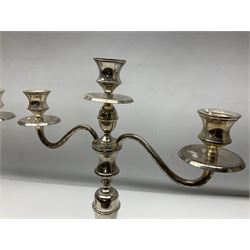 Pair of silver plated three branch candelabra, knop stemmes raises on stepped oval bases, H38cm