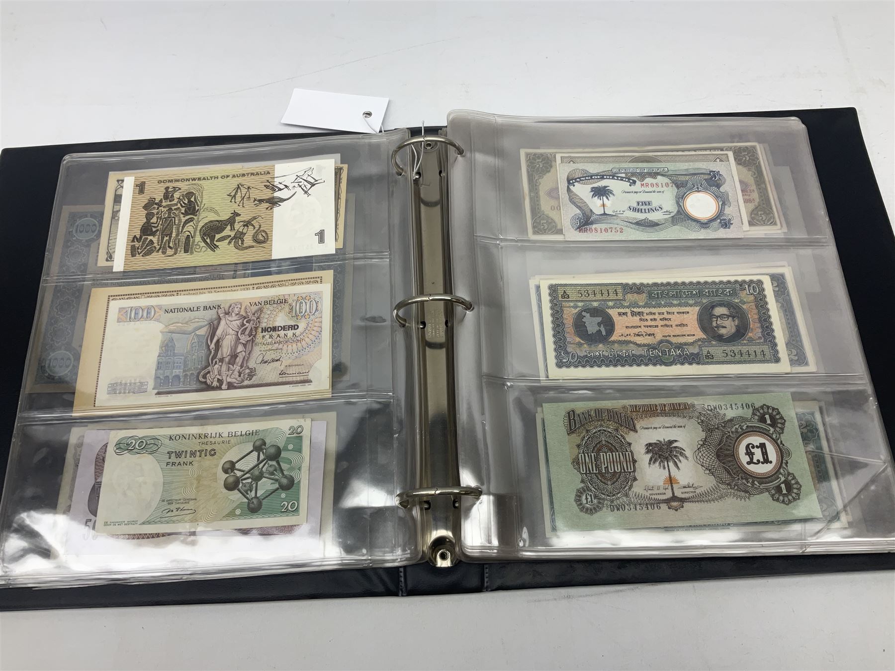 World banknotes, including Queen Elizabeth II The States of Jersey one pound 'DB202703', five pounds 'BB527762' and ten pounds 'AB651481', reserve bank of New Zealand two dollars '1L3 741894', King George V Straits Settlements one dollar 1st January 1935 'F/83 28924', various Bank of England notes etc, housed in two ring binder albums