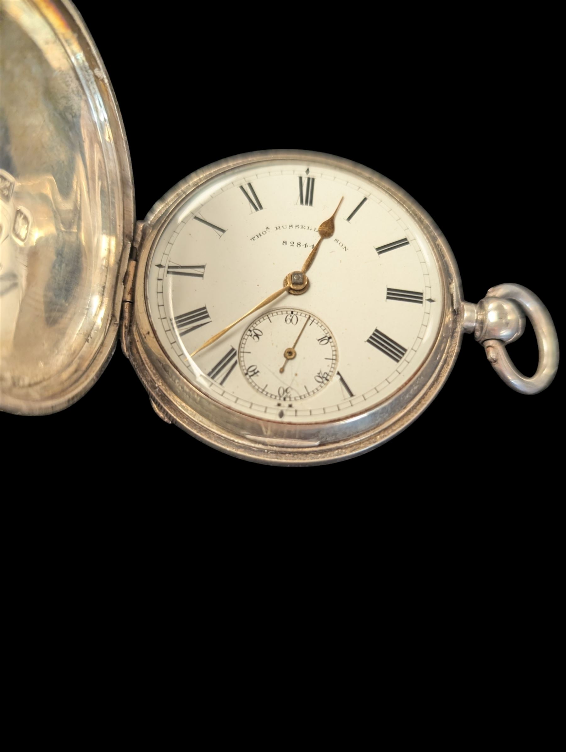 Late Victorian silver full hunter pocket watch by Tho Russell & Son no. 82844, with white enamel dial and subsidiary seconds dial, the front cover with blank cartouche, hallmarked Chester 1891