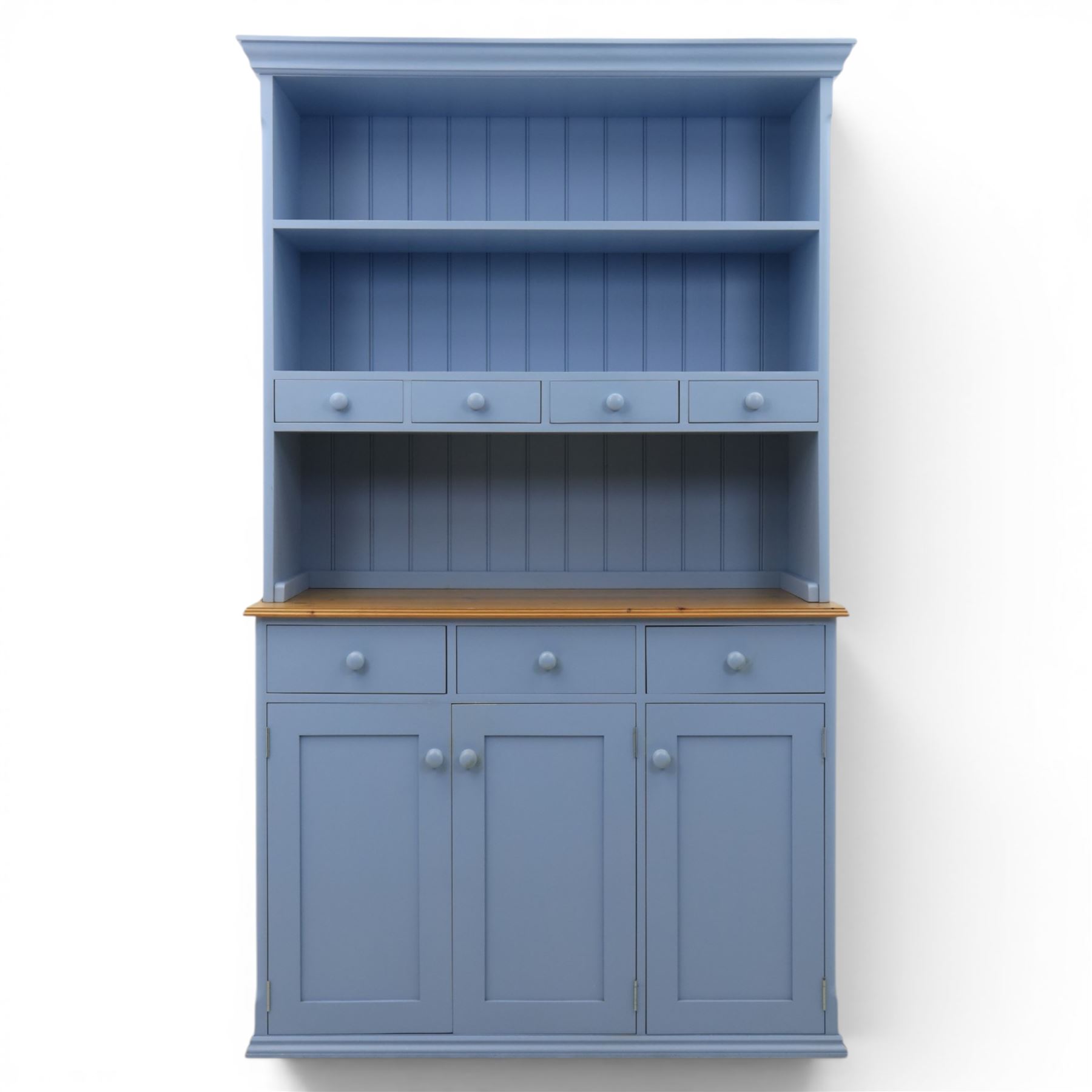 Pine blue painted dresser, upper section with tongue and grove back, two shelves with three short drawers, above a base with soft close short drawers, and three cupboard doors, raised on a moulded plinth base