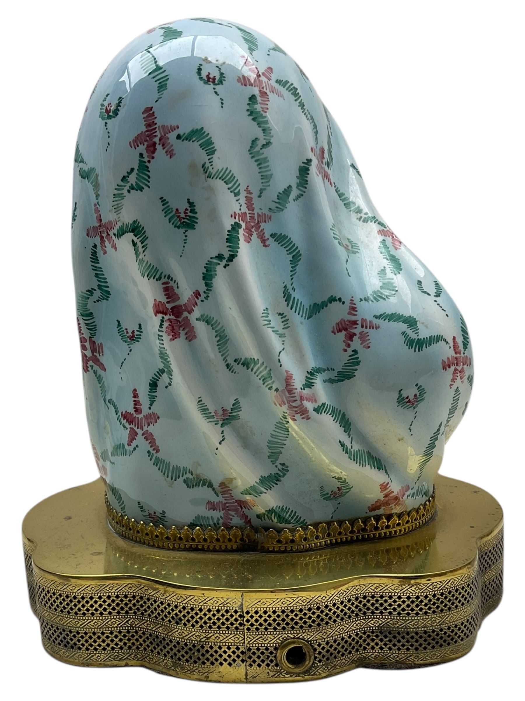 Madonna and Child painted porcelain bust, possibly Italian, on pierced brass base