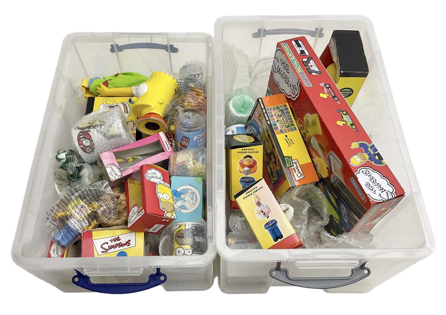 Large quantity of The Simpsons merchandise and memorabilia, to include Micro Scalextric, mugs, jigsaw, bottle openers, solar pal, glasses, etc, many boxed