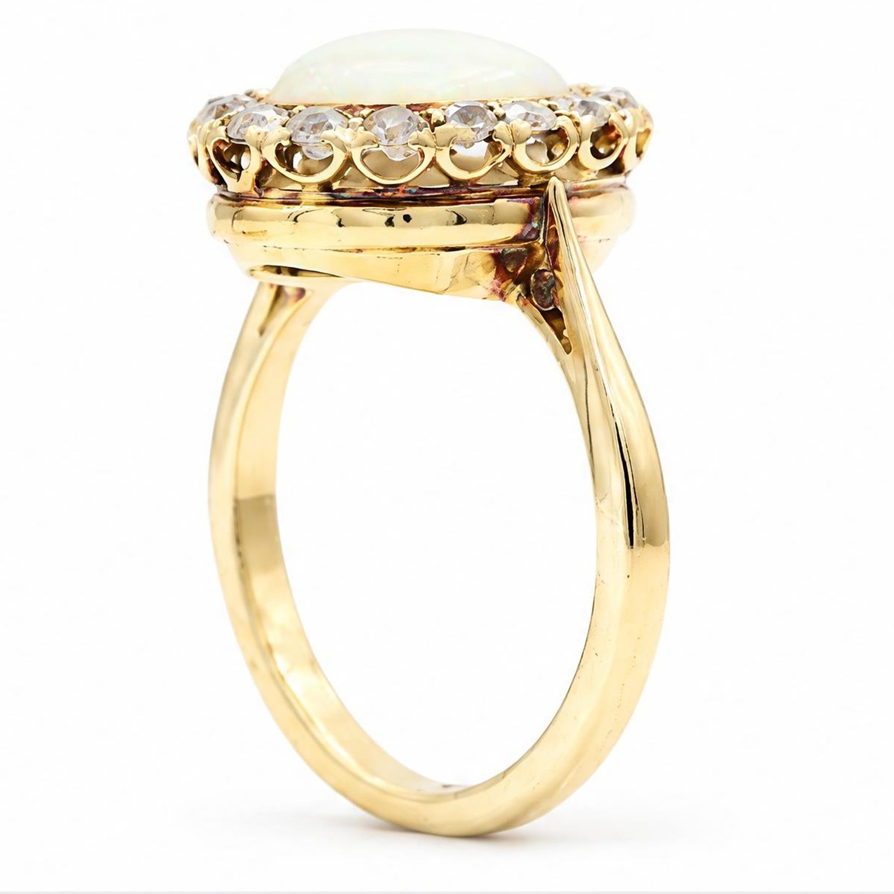 Early 20th century gold opal and diamond cluster ring, single oval cabochon opal, surrounded by sixteen old cut diamonds, stamped 18ct, total diamond weight approx 0.65 carat