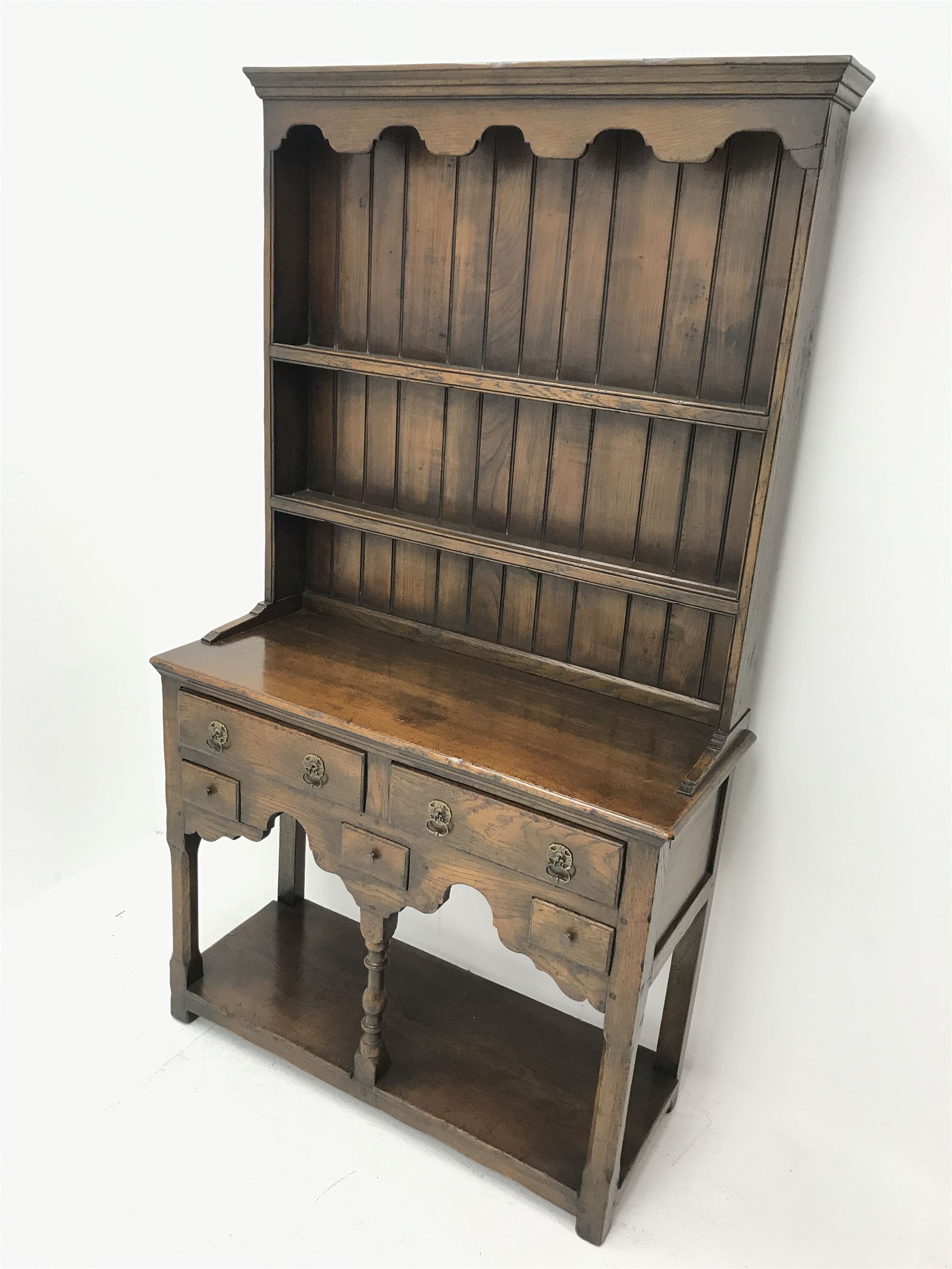 Small Georgian style distressed medium oak dresser, fitted with five drawers, pot-board base and two tier plate rack, W91cm, D37cm, H162cm