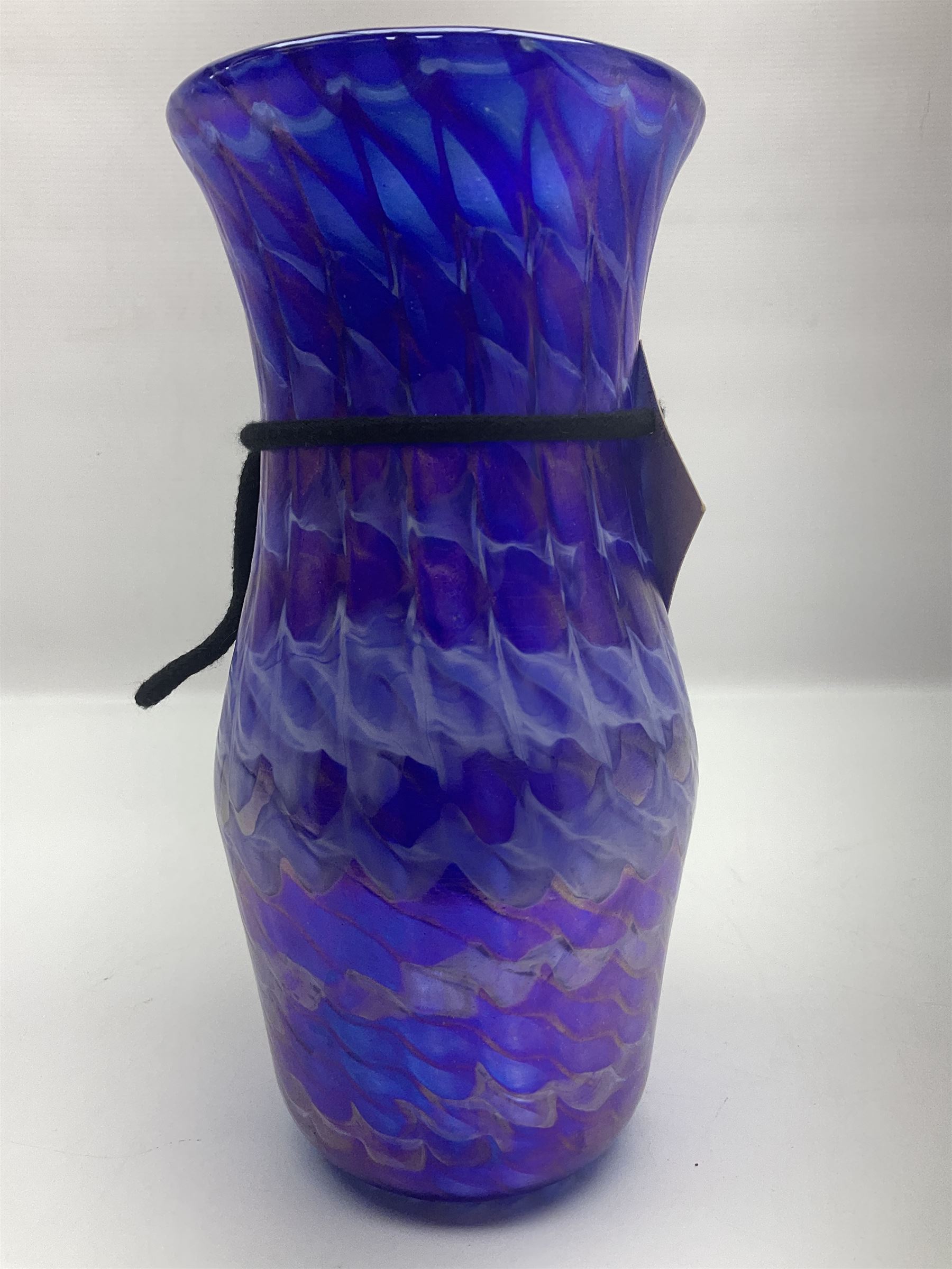 John Ditchfield for Glasform studio glass vase, with mottled wave design upon an iridescent purple ground, signed and numbered beneath, with certificate of authenticity tag, H26.5cm