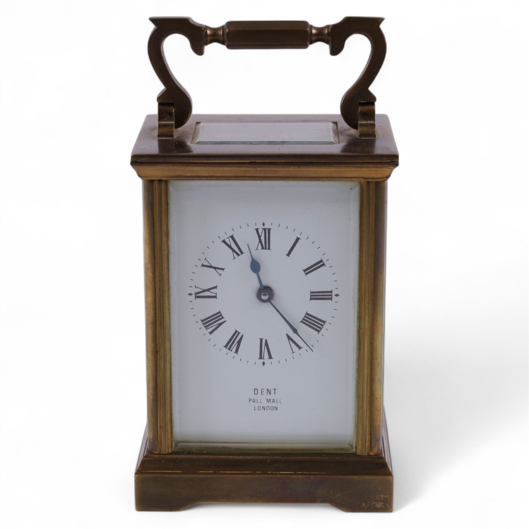 French-Early 20th century 8-day corniche carriage clock with a replacement lever platform escapement, enamel dial with Roman numerals and retailers name 