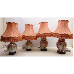  Pair Oriental style porcelain table lamps on plinths and three other similar style lamps, all having matching shades, H64cm maximum   