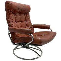 Mid-20th century Scandinavian easy chair, chromed metal frame upholstered in buttoned terracotta leather, swivel and reclining action (W84cm, H95cm); together with matching footstool (W55cm, H40cm)