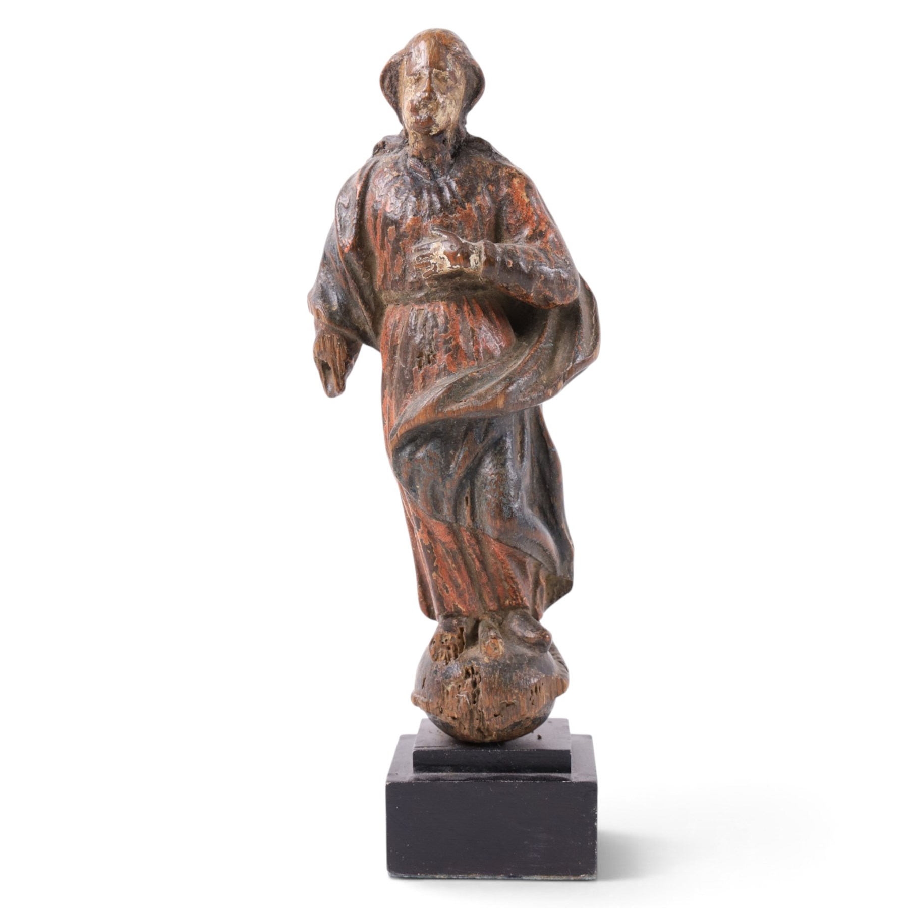 17th century, continental figure of saint, with painted polychrome detail, the figure adorned in robes, with hand on chest, upon a later wooden plinth, H31cm