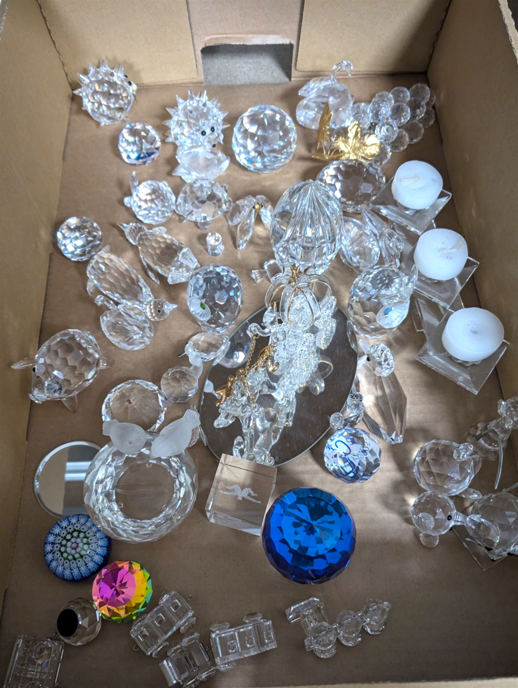 Collection of Swarovski figures, including owls, cats, penguins etc, together with Perthshire paperweight 