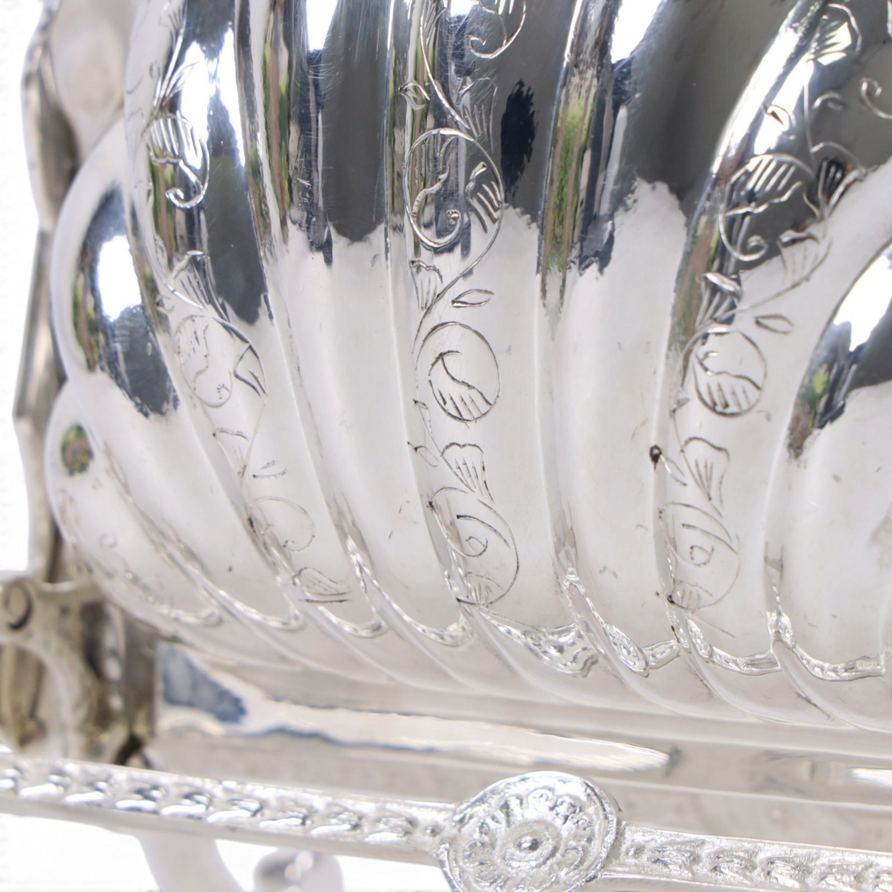 Silver-plated Victorian style biscuit box, in a shell form with engraved leaf detailing, upon scroll feet, H24cm