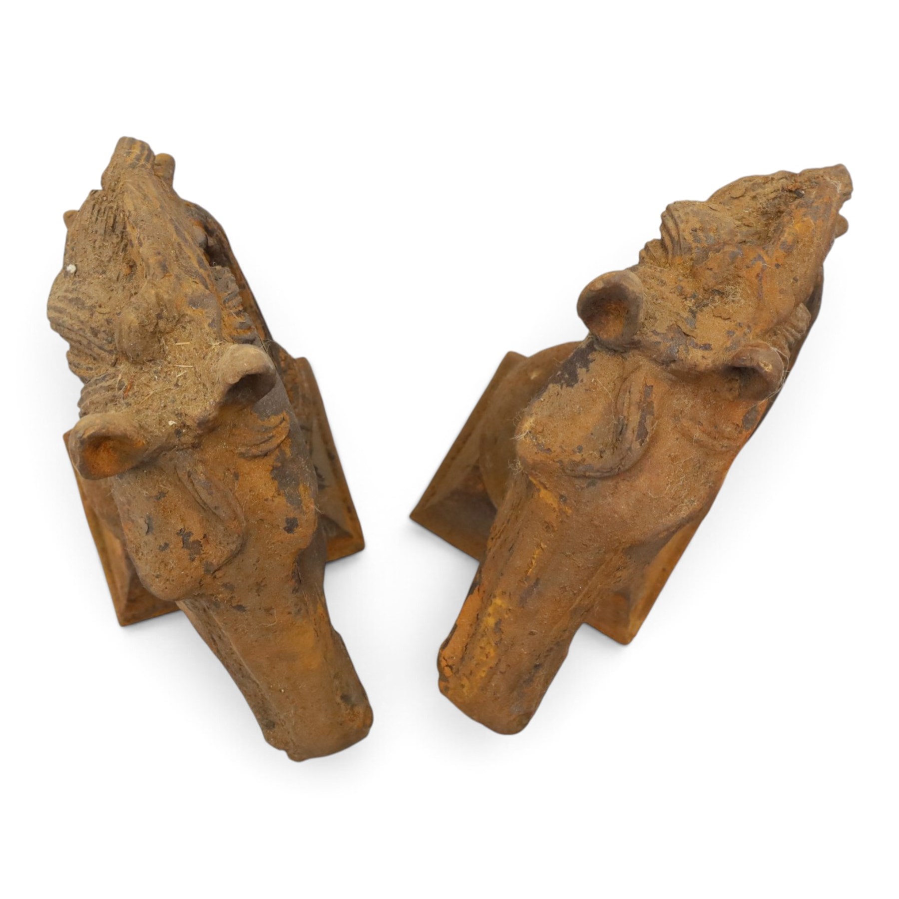 Pair of antique cast iron garden finials or statues of horse heads or busts, the heads with flowing and pierced mane, mounted on spherical finials over square tapering bases