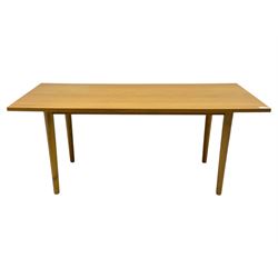 Ikea - Rectangular oak table, slim rectangular top over rounded edges, supported by tapered cylindrical legs  