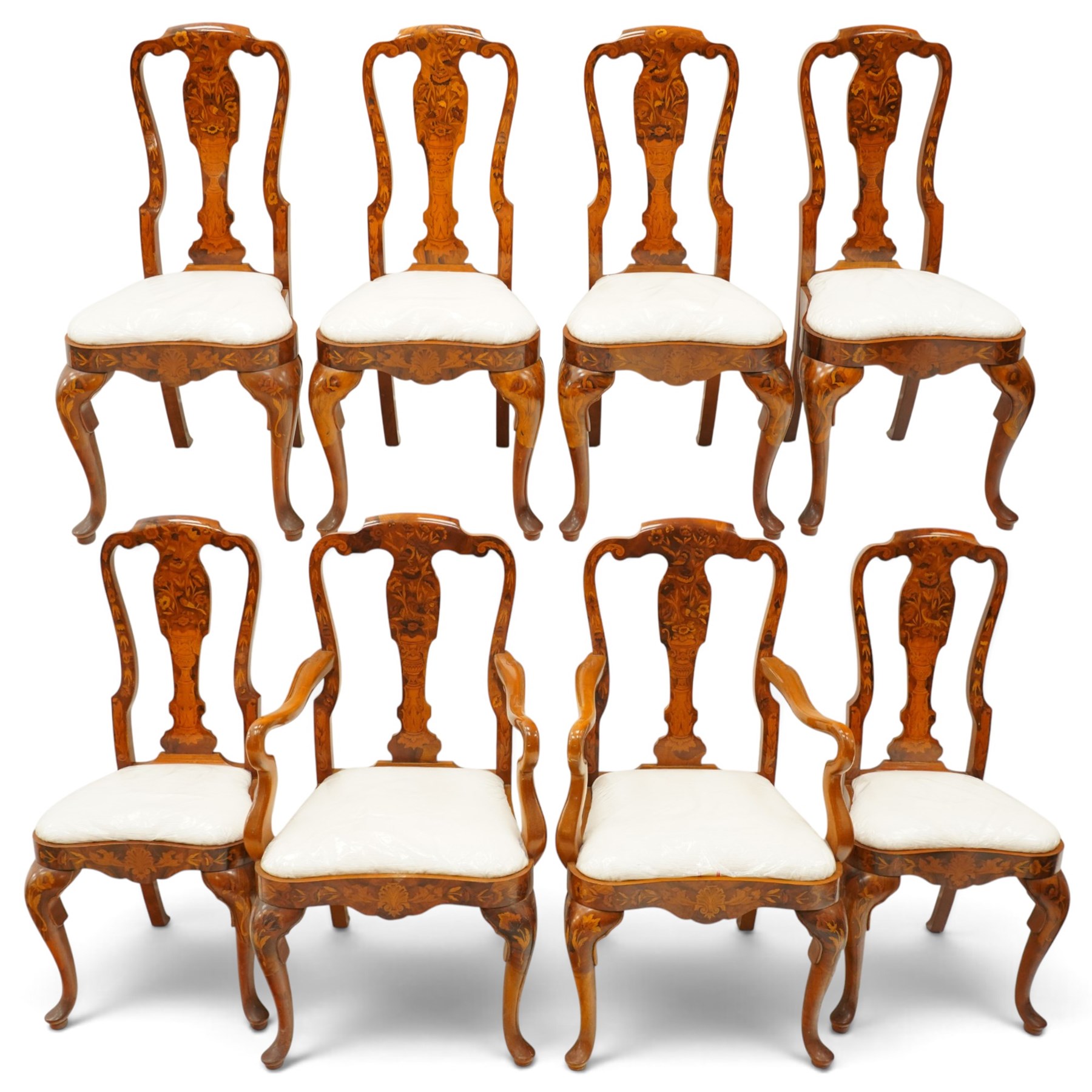 Set of eight (6+2) Dutch design walnut and floral marquetry dining chairs, the high backs with shaped cresting rail over a vasiform splat inlaid with Neoclassical urns and bouquets of foliage and bellflowers, ivory upholstered drop-in seat over scallop shell inlaid apron and cabriole supports with pad feet