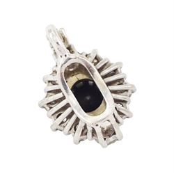 18ct white gold diamond pendant, single round brilliant cut black diamond of approx 0.90 carat, surrounded by ten round brilliant cut white diamonds, the bail set with a further diamond, total white diamond weight approx 0.80 carat
