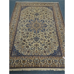  Fine Nain beige and blue ground rug, central medallion on floral field, repeating border, 307cm x 212cm  