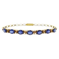 14ct gold oval cut sapphire and round brilliant cut diamond bracelet, stamped 585
