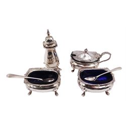 Early 20th century silver matched cruet set, comprising pepper shaker, mustard pot and cover, two open salts and two condiment spoons, all hallmarked with various dates and makers 