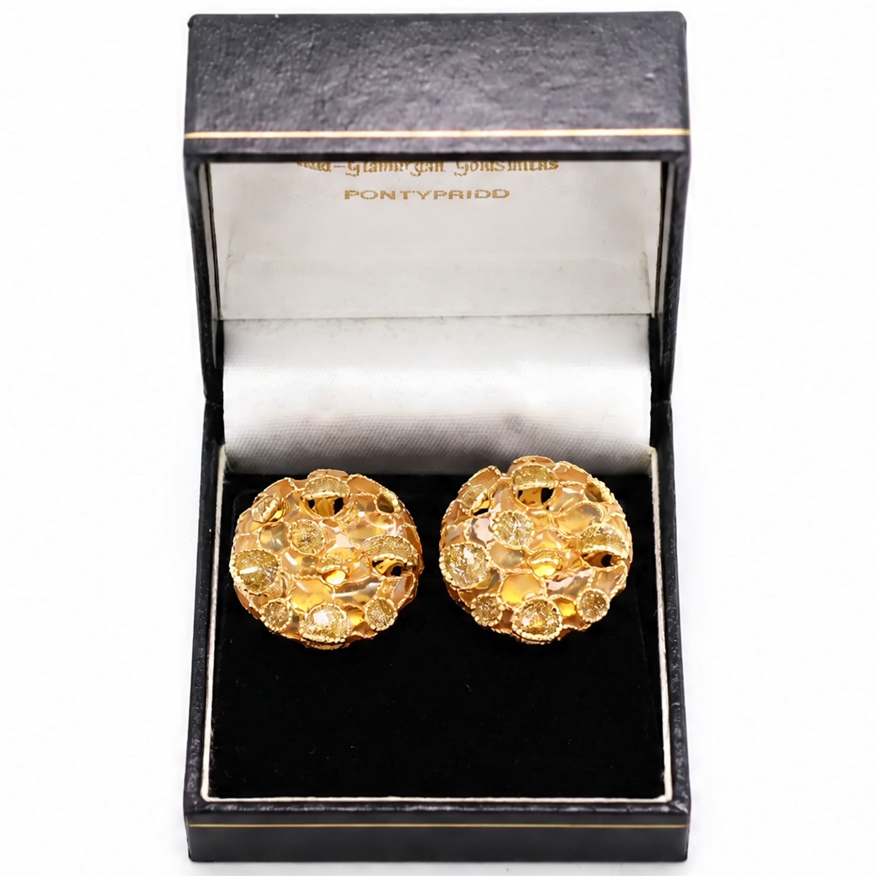 Pair of 18ct gold plique-à-jour earrings, each circular stud with yellow and gold glitter plique-à-jour decoration, some raised within a beaded and rope twist framework, stamped 750
