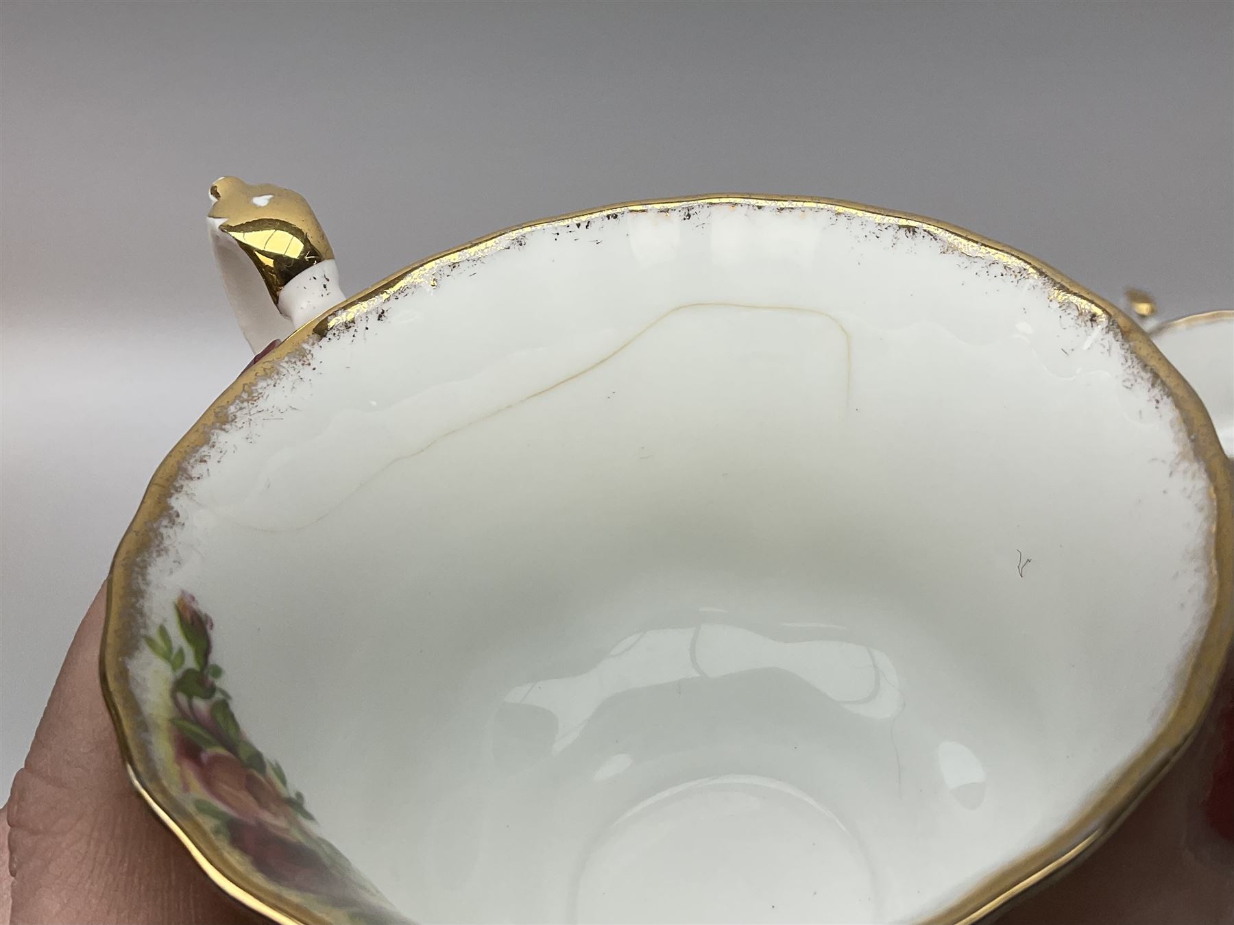 Royal Albert Old Country Roses pattern tea set, comprising teapot, coffee pot, six teacups and six saucers, five side plates, further teacup with joined saucer and side plate, open sucrier, milk jug, cake plate, and preserve pot and cover, together with Royal Albert Jubilee Rose pattern sauce boat and stand, and Royal Albert Lavender Rose pattern cake stand. 