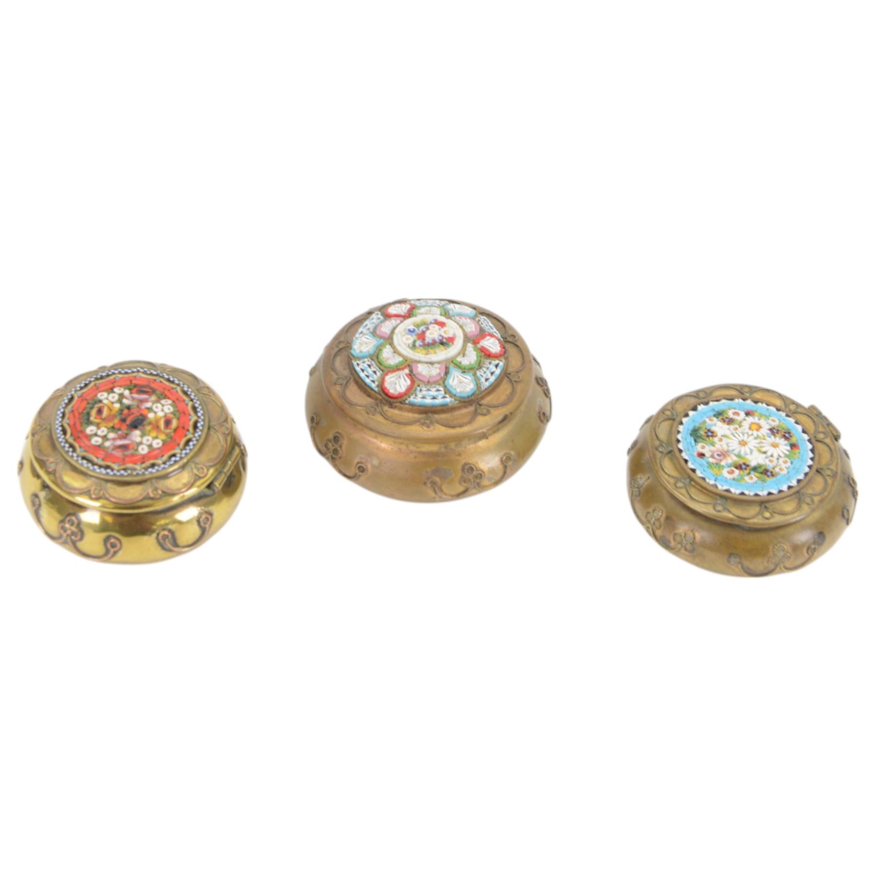 Eight micro mosaic pill boxes, the hinged lids decorated with floral designs  