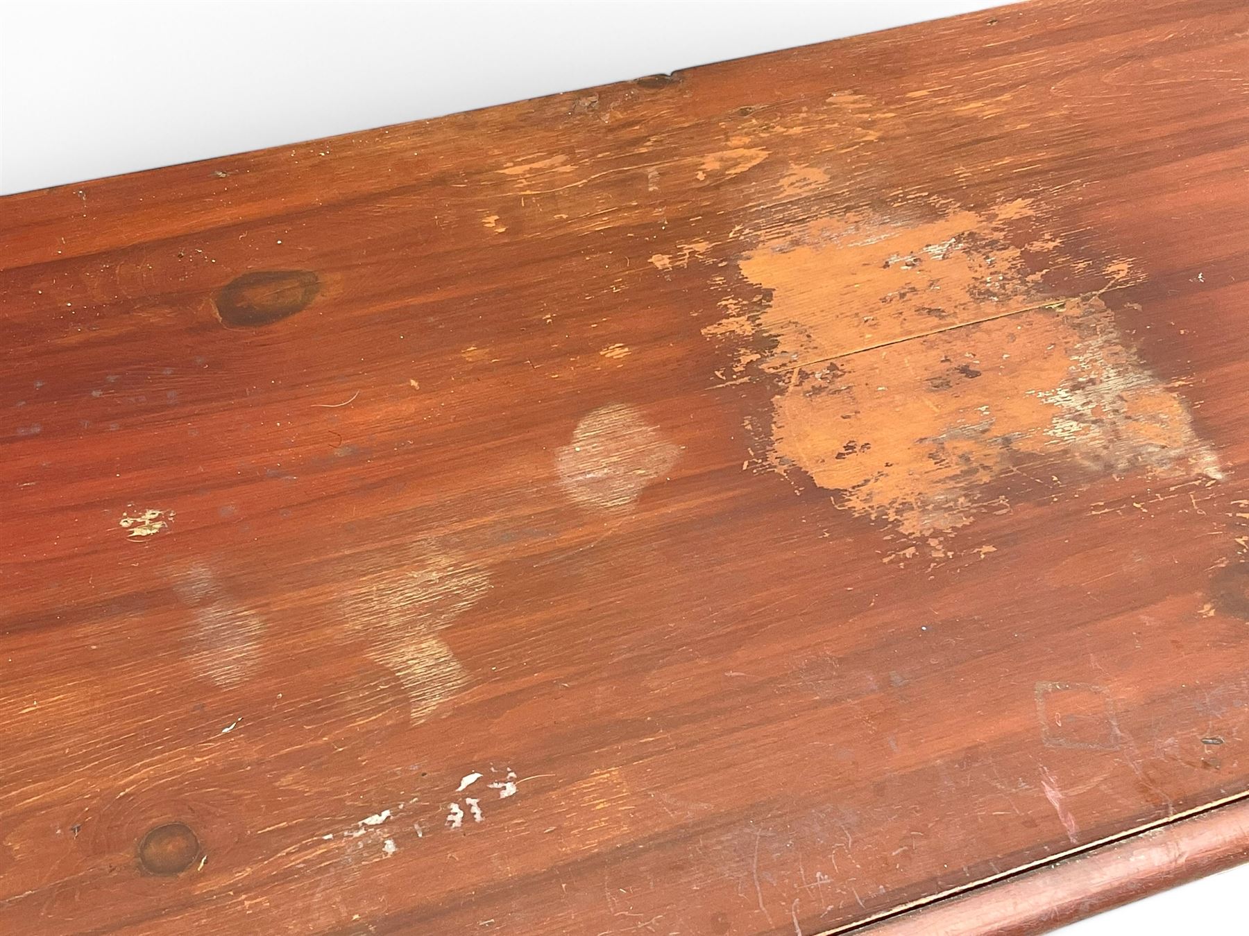 Victorian 19th century stained pine chest of drawers, rectangular top above two short and three long drawers with turned wooden handles, raised on bun feet with castors.