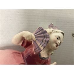 Early 20th century Katzhütte figure of a pointer dog, and figure of a young girl holding basket and fan, both with green cat H house printed mark beneath, dog L25cm